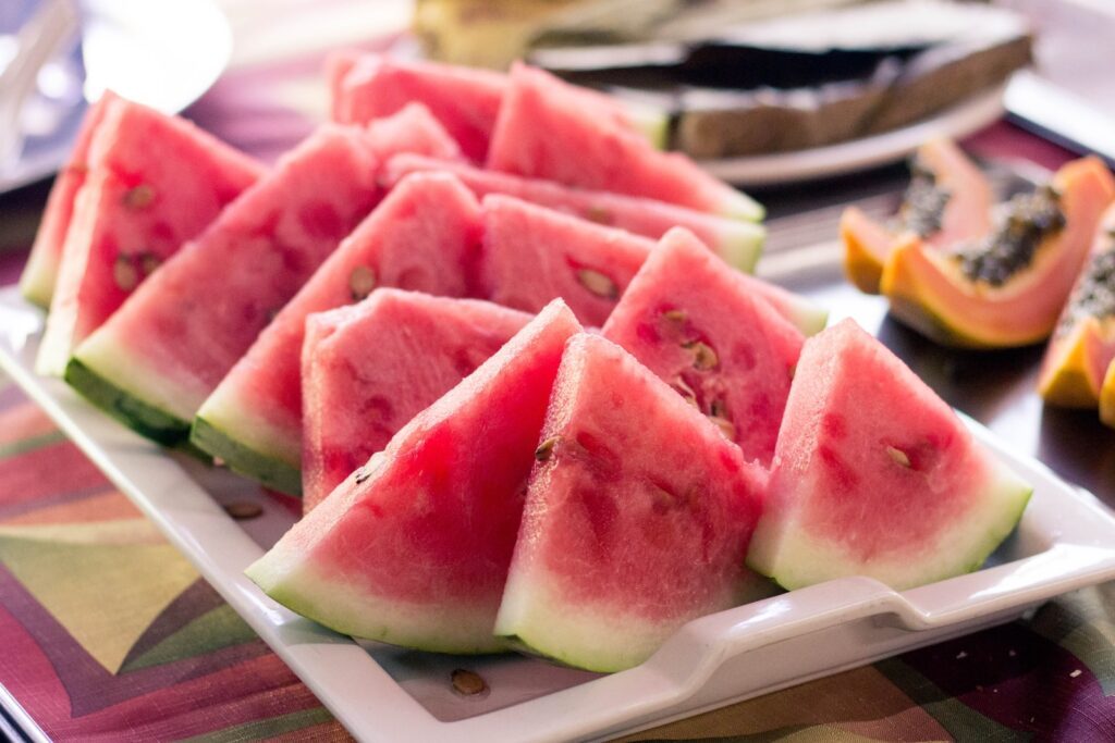 sliced watermelon in white ceramic tray on table