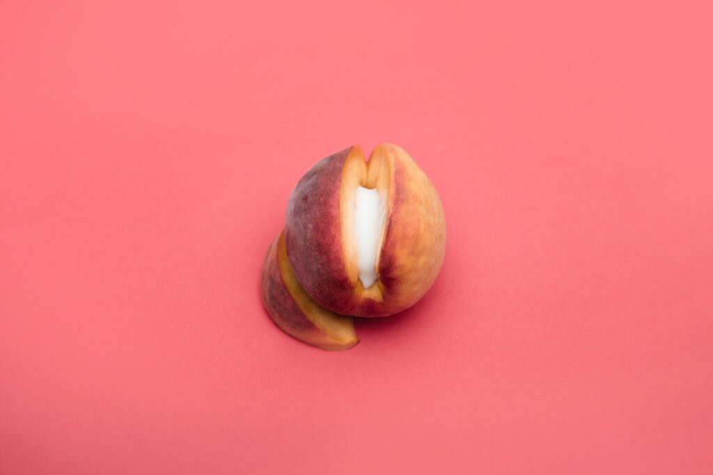 sliced apple fruit on red surface
