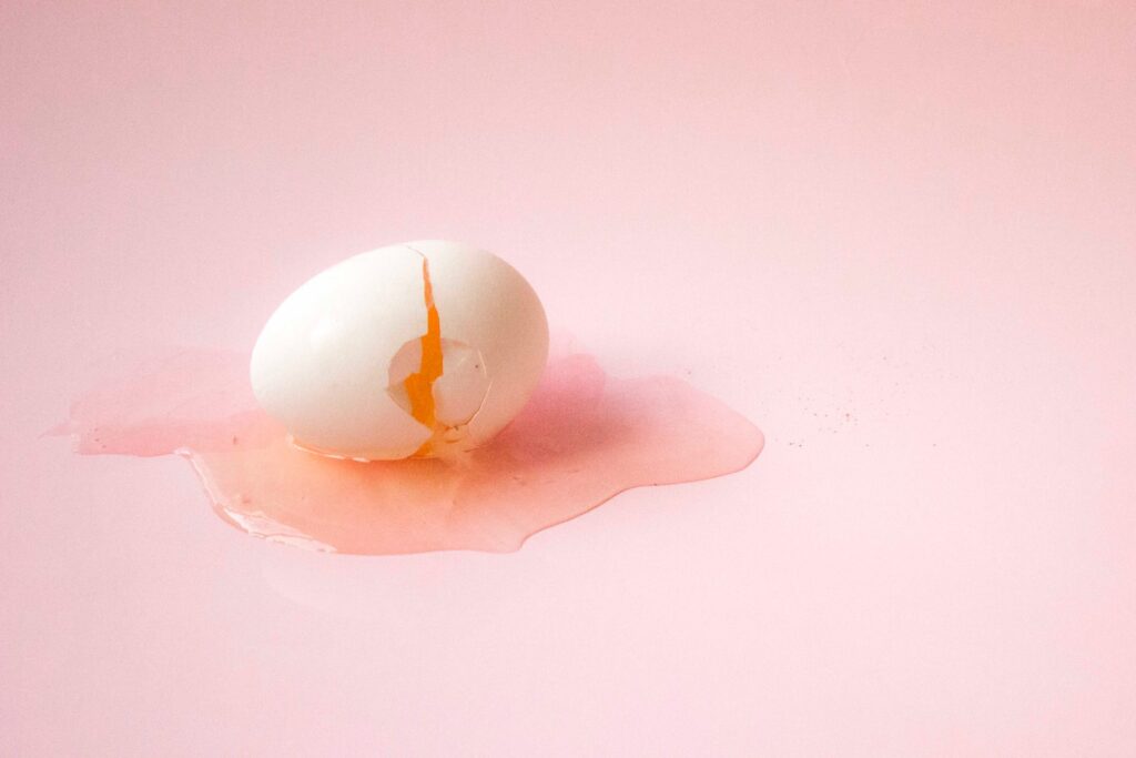 White egg on white surface