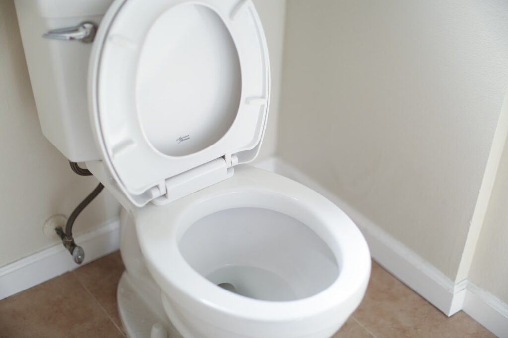 White ceramic toilet bowl with cover