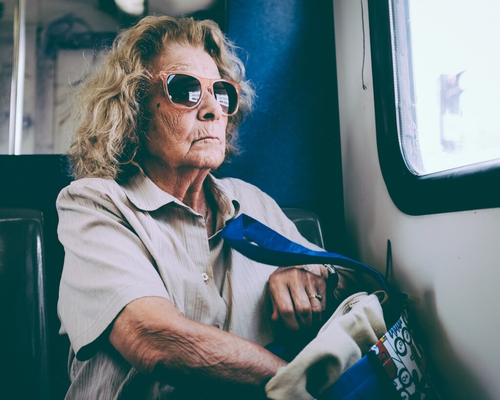 woman sitting on chair in front of window