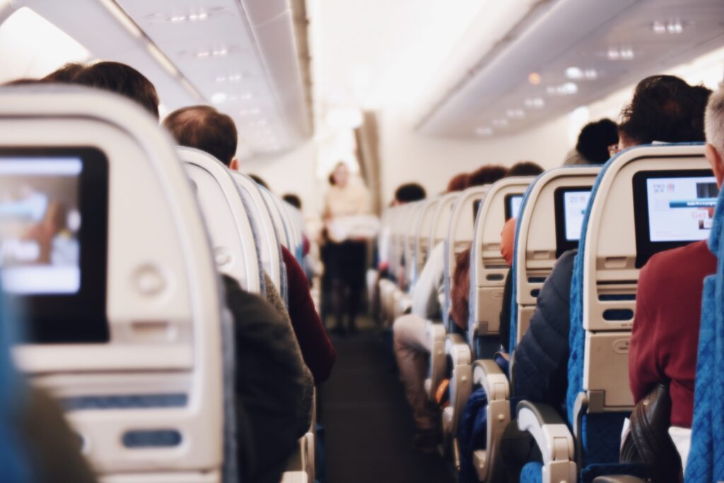 Shallow focus photography of people inside of passenger plane