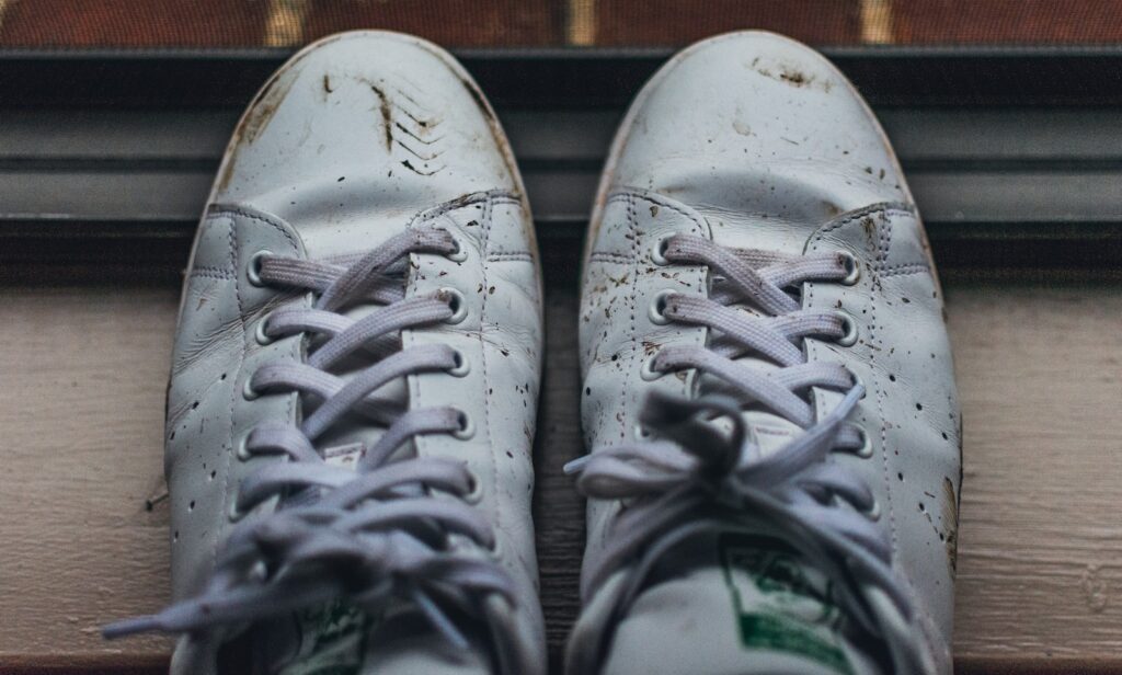 gray and white nike athletic shoes