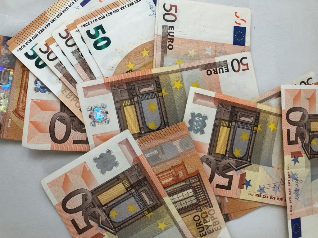 50 euro banknote lot on white surface