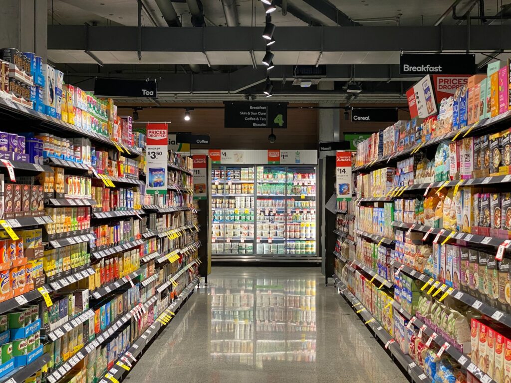 white and red labeled pack on white shelf